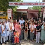 Delhi Lok Sabha polls: Mira Devi, 85, and children voting for the first time were honoured with flower garlands by the RWA in sectors 3, 5, and 6 in New Delhi on Saturday.(HT Photo)